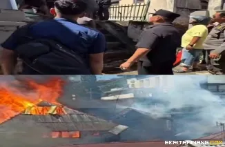 Kelihata  Wako Bukittinggi Ramlan Nurmatias ikut mengarahkan petugas dalam proses pemadaman api yang membakar satu unit rumah semi permanen di kawasan Porak Kopi,kamis (28/05)